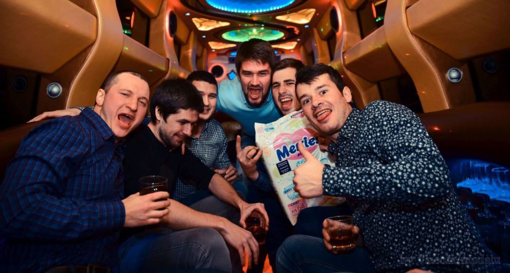 group of men inside on limo celebrating birthday