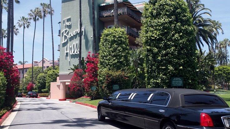 image is showing Beverly Hills hotel and black limo