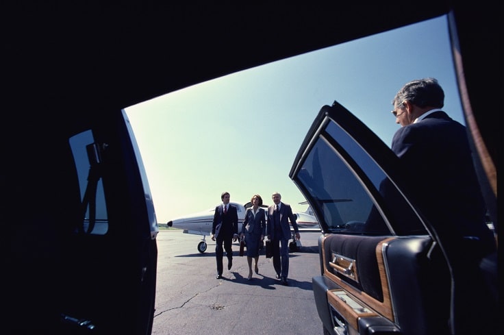 image of corporate limo and business woman