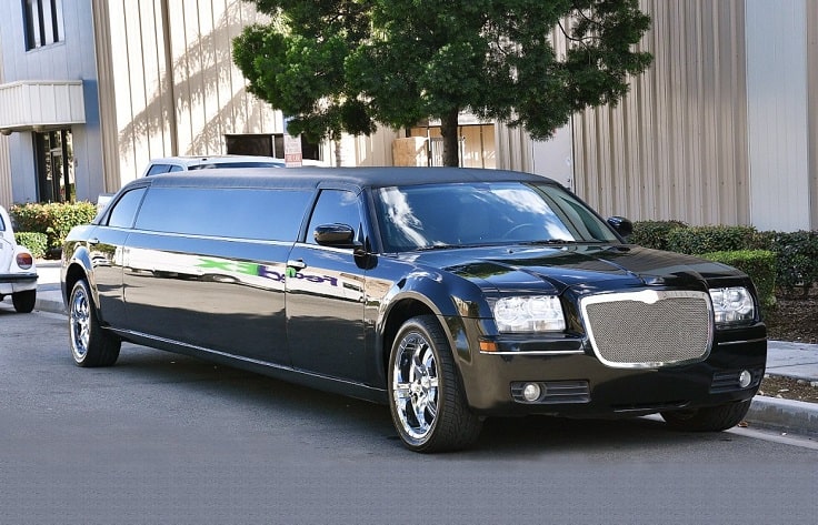 image is showing black Limousine on the street of Palm Springs