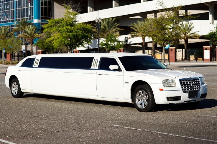 image is showing white Limousine on the road going to SFO airport