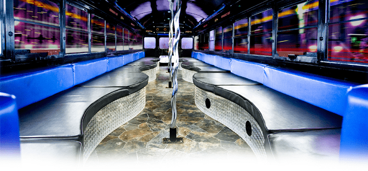 image is showing luxury party bus interior - black and blue colors