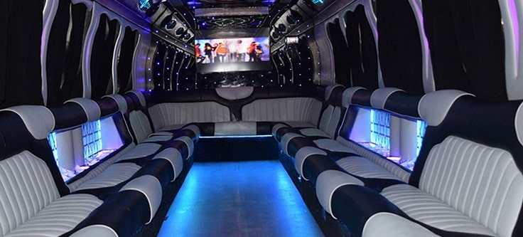 image showing grey, black with blue lighting party bus interior