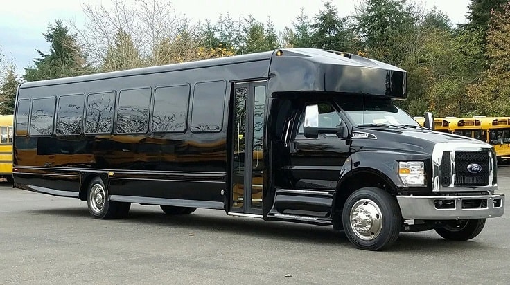 image is showing black ford party bus in Orange County