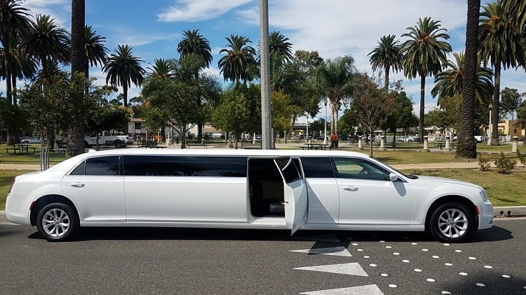 image is showing a white limo and palms in Pasadena