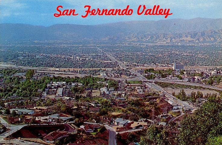 image is showing post card with san fernando valley view